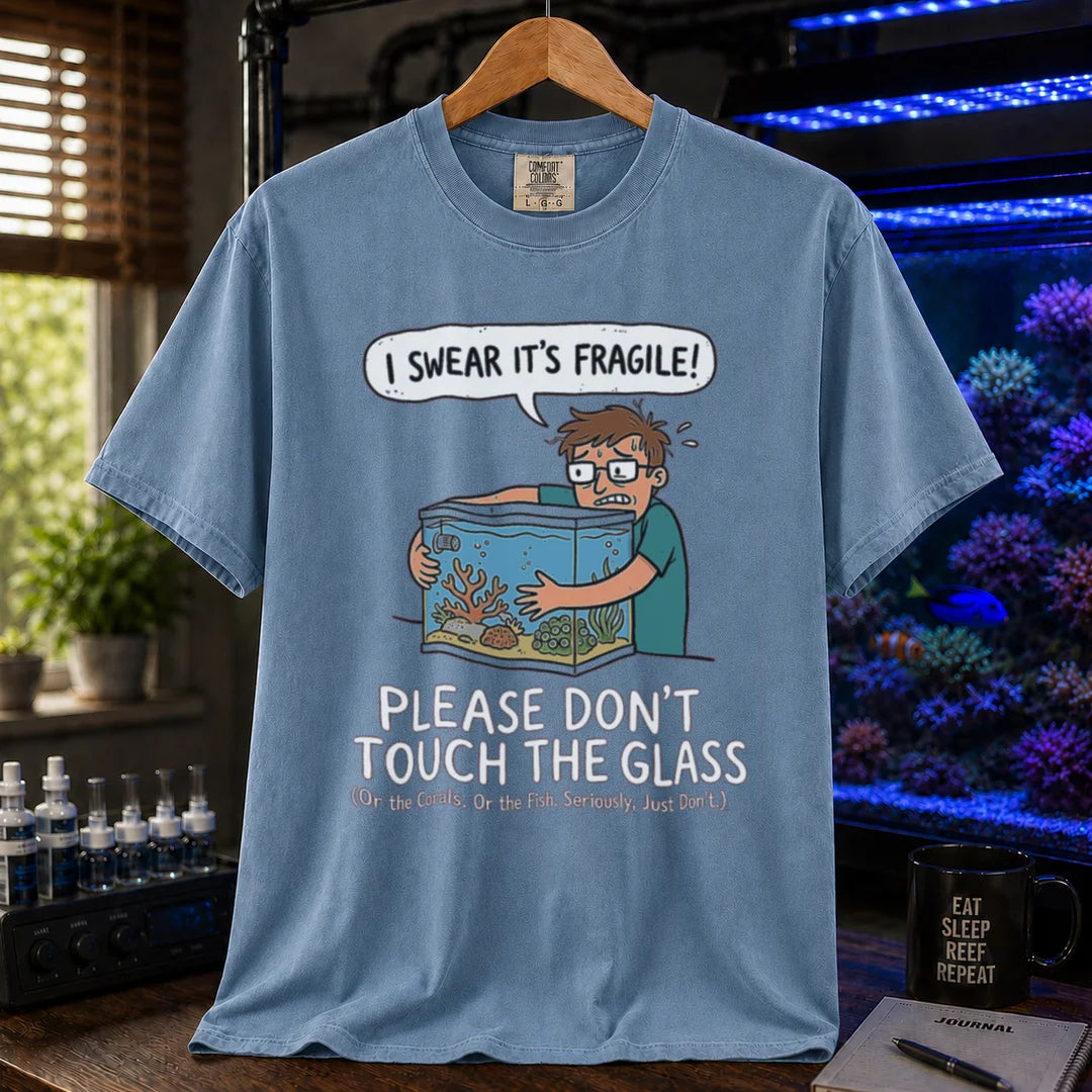 Saltwater aquarium graphic t-shirt featuring an anxious aquarist hugging a tank illustration and text: I SWEAR IT'S FRAGILE! PLEASE DON'T TOUCH THE GLASS, blue crew neck tee