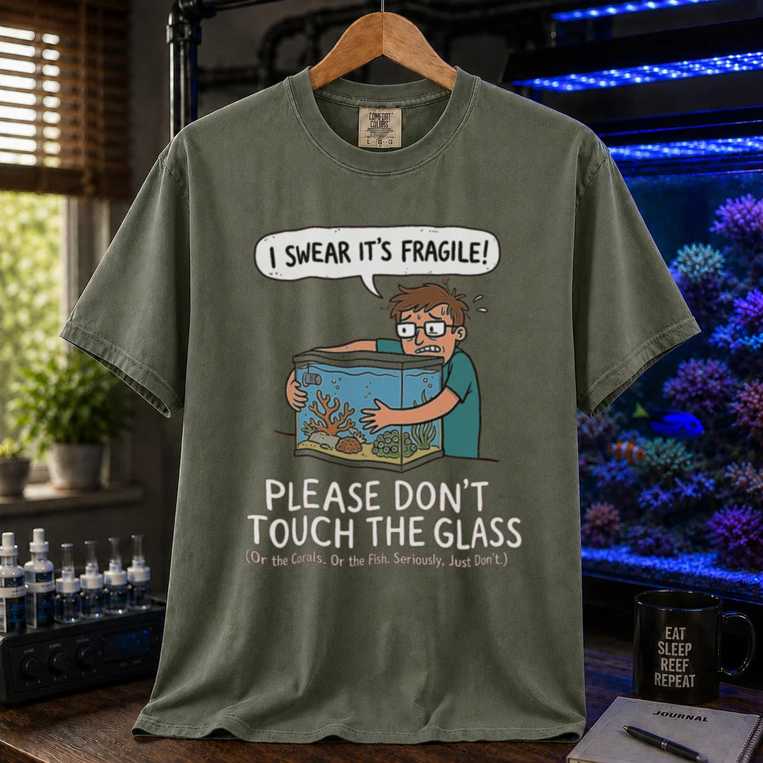 Saltwater aquarium graphic t-shirt featuring an anxious aquarist hugging a tank illustration and text: I SWEAR IT'S FRAGILE! PLEASE DON'T TOUCH THE GLASS, military green crew neck tee