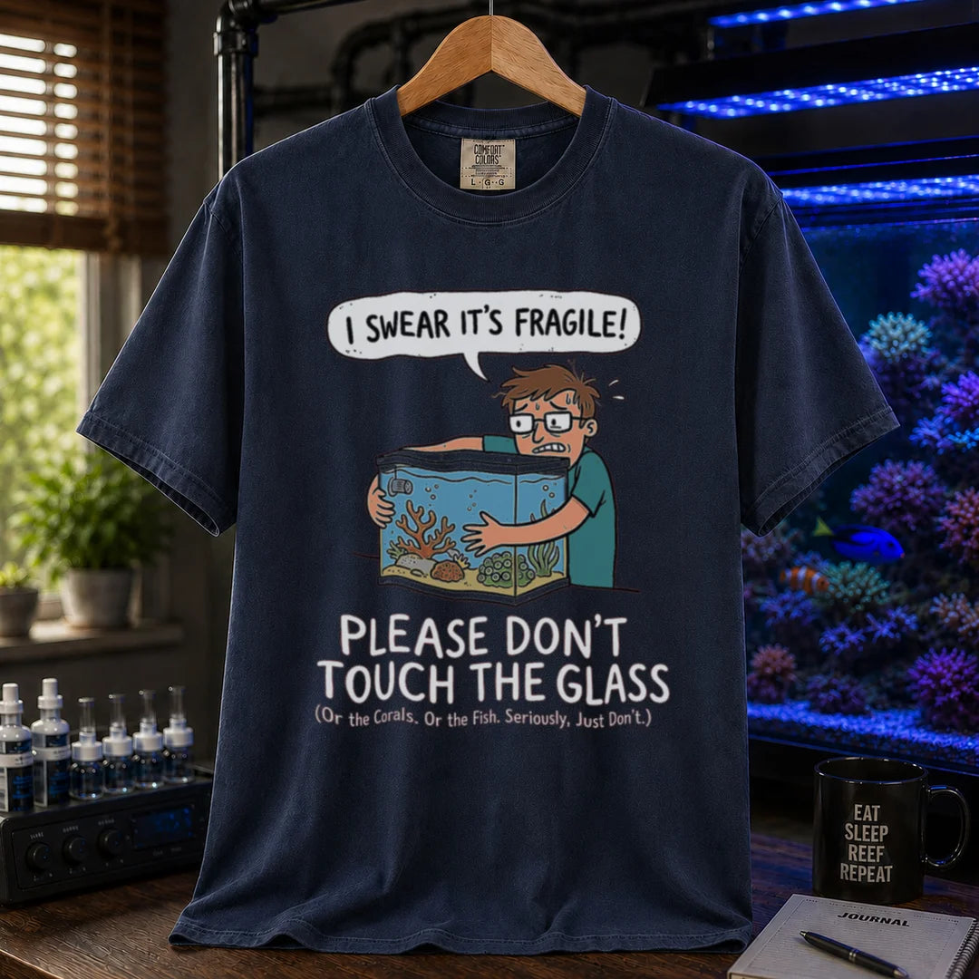 Saltwater aquarium graphic t-shirt featuring an anxious aquarist hugging a tank illustration and text: I SWEAR IT'S FRAGILE! PLEASE DON'T TOUCH THE GLASS, navy crew neck tee
