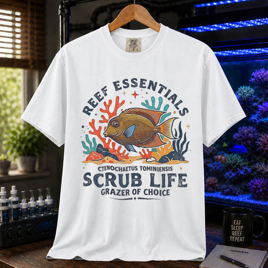 Saltwater aquarium graphic t-shirt featuring a Tomini Tang illustration and text: REEF ESSENTIALS SCRUB LIFE GRAZER OF CHOICE, white crew neck tee