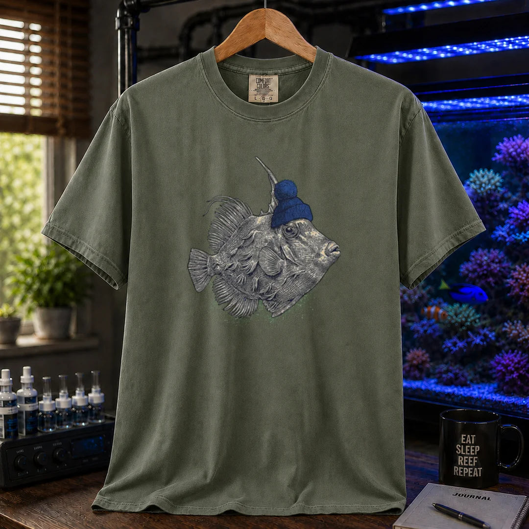 Saltwater aquarium graphic t-shirt featuring a filefish wearing a blue beanie illustration, military green crew neck te