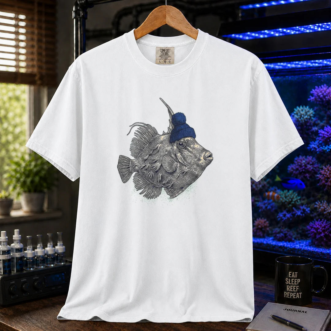 Saltwater aquarium graphic t-shirt featuring a filefish wearing a blue beanie illustration, white crew neck te