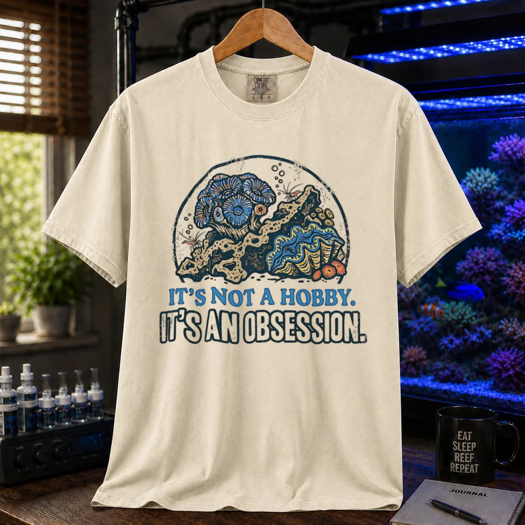 Saltwater aquarium graphic t-shirt featuring a reef aquascape illustration and text: IT'S NOT A HOBBY. IT'S AN OBSESSION., ivor crew neck tee