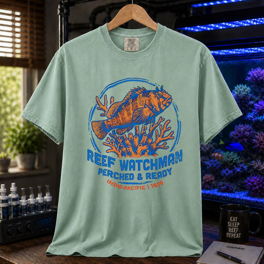 Saltwater aquarium graphic t-shirt featuring a fish perched on coral and text: REEF WATCHMAN PERCHED & READY INDO-PACIFIC 1978, green crew neck tee