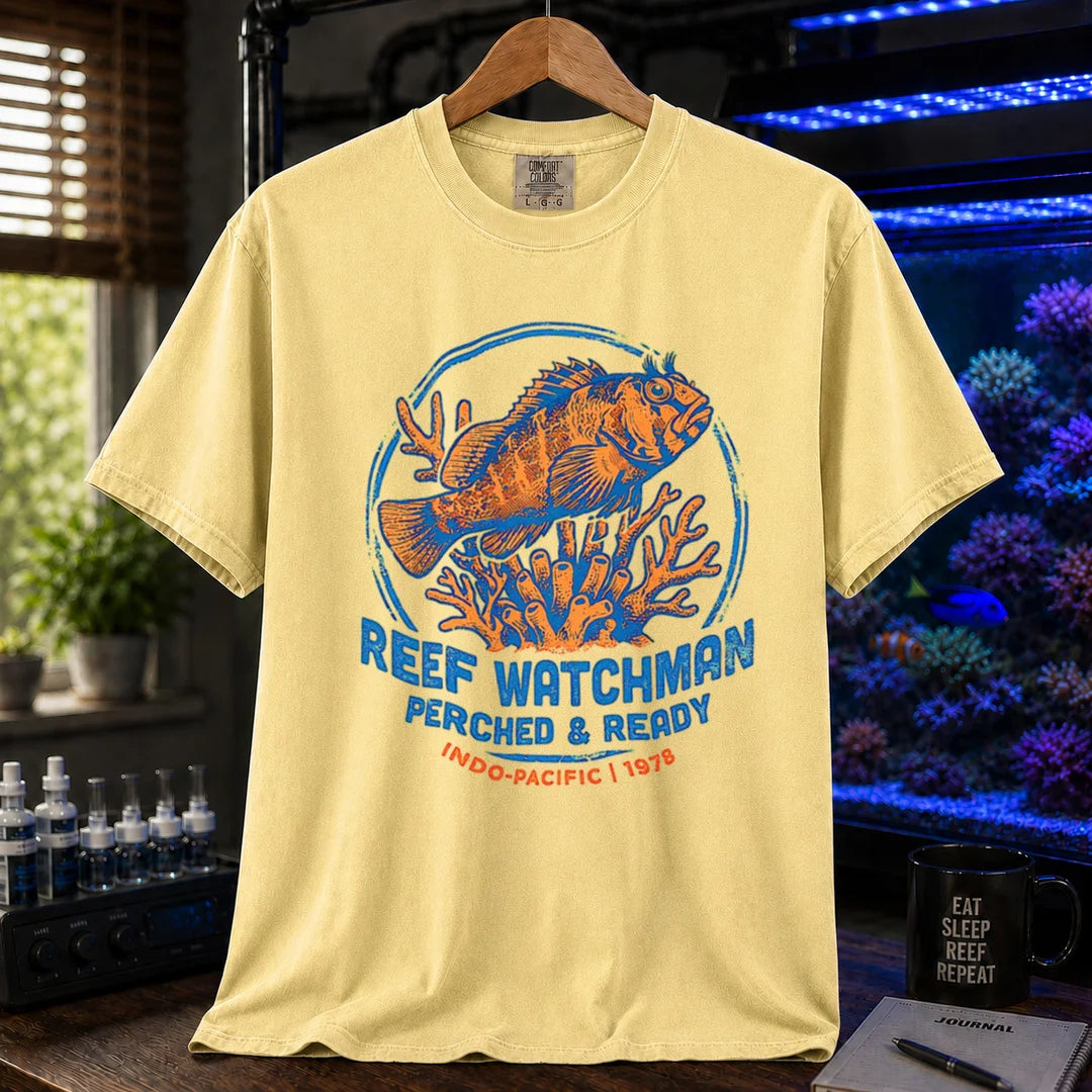 Saltwater aquarium graphic t-shirt featuring a fish perched on coral and text: REEF WATCHMAN PERCHED & READY INDO-PACIFIC 1978, yellow crew neck tee