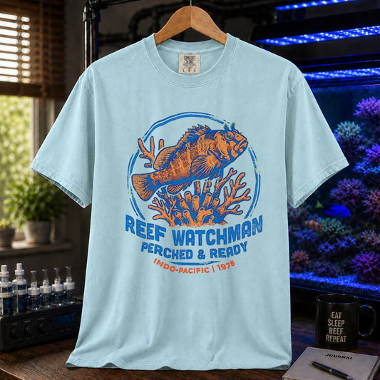 Saltwater aquarium graphic t-shirt featuring a fish perched on coral and text: REEF WATCHMAN PERCHED & READY INDO-PACIFIC 1978, light blue crew neck tee