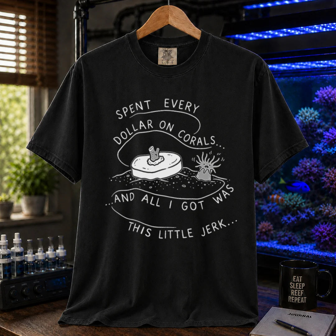 Saltwater aquarium graphic t-shirt featuring a frag plug illustration and text: SPENT EVERY DOLLAR ON CORALS... AND ALL I GOT WAS THIS LITTLE JERK..., black crew neck tee