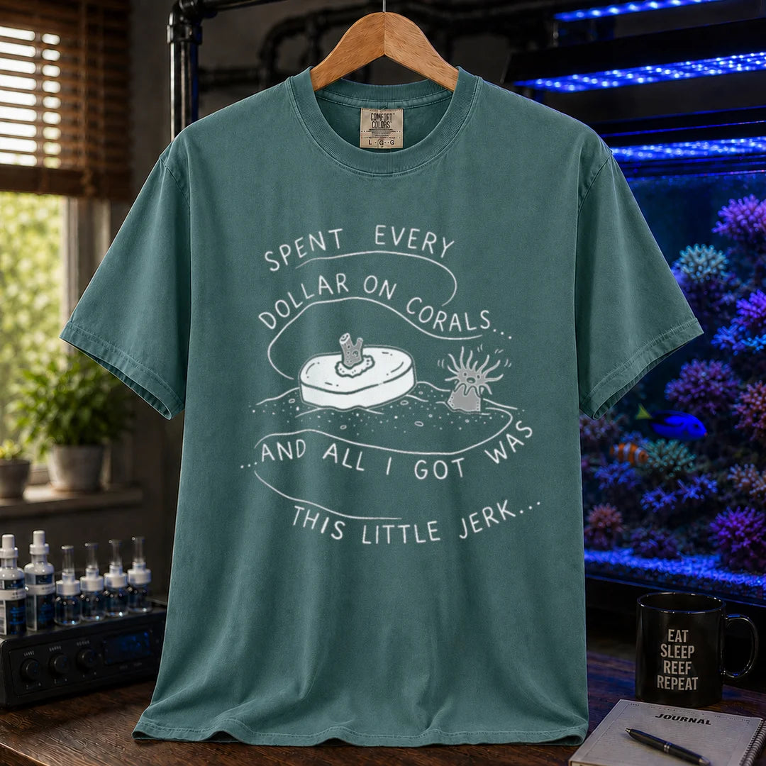 Saltwater aquarium graphic t-shirt featuring a frag plug illustration and text: SPENT EVERY DOLLAR ON CORALS... AND ALL I GOT WAS THIS LITTLE JERK..., green crew neck tee