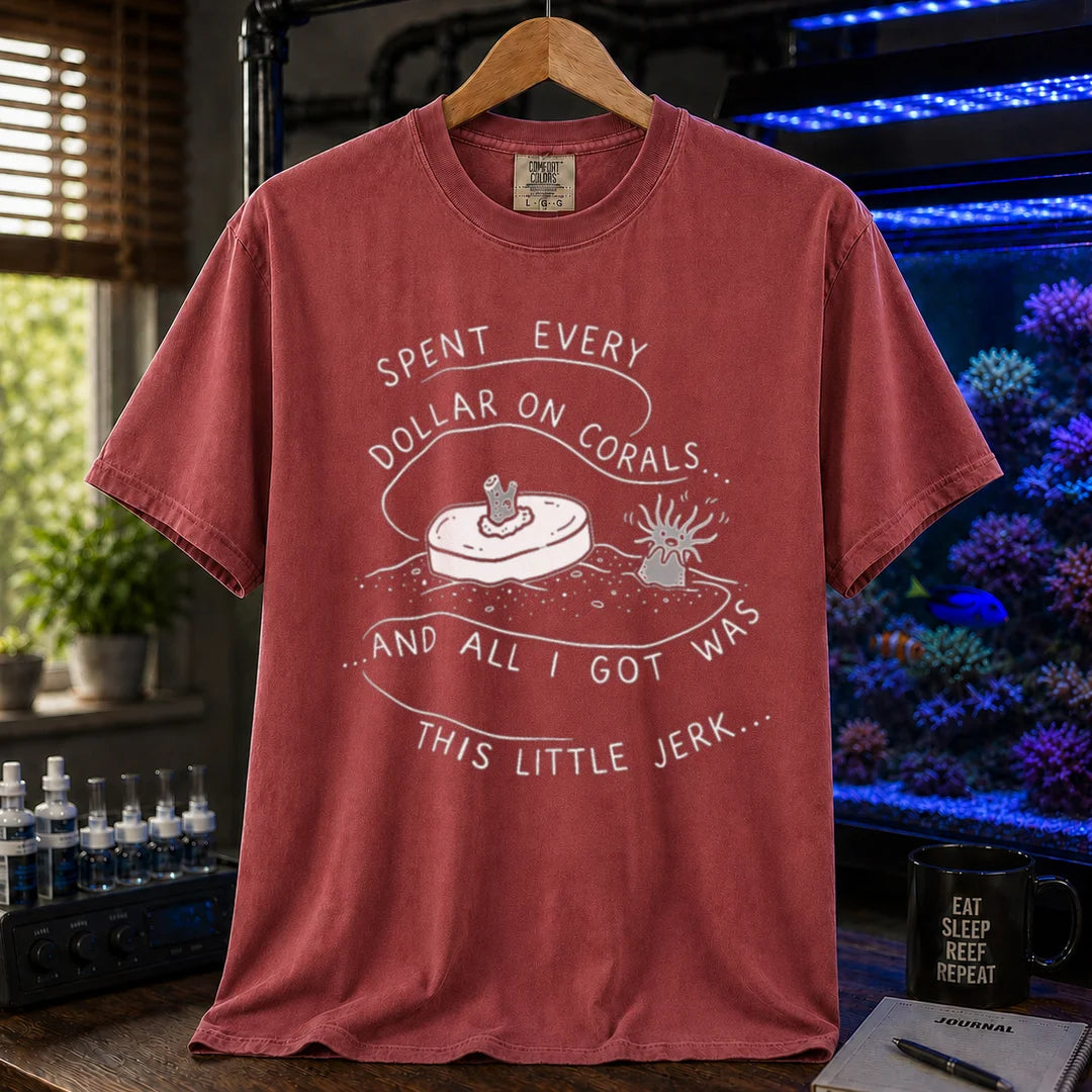 Saltwater aquarium graphic t-shirt featuring a frag plug illustration and text: SPENT EVERY DOLLAR ON CORALS... AND ALL I GOT WAS THIS LITTLE JERK..., maroon, red crew neck tee