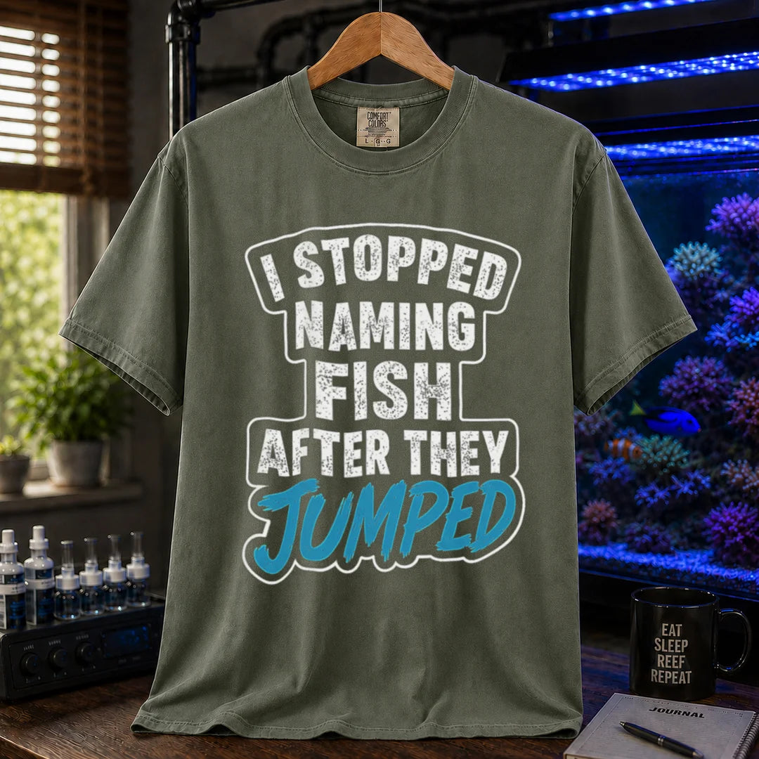 Saltwater aquarium graphic t-shirt featuring distressed block text and blue script: I STOPPED NAMING FISH AFTER THEY JUMPED, military green crew neck tee