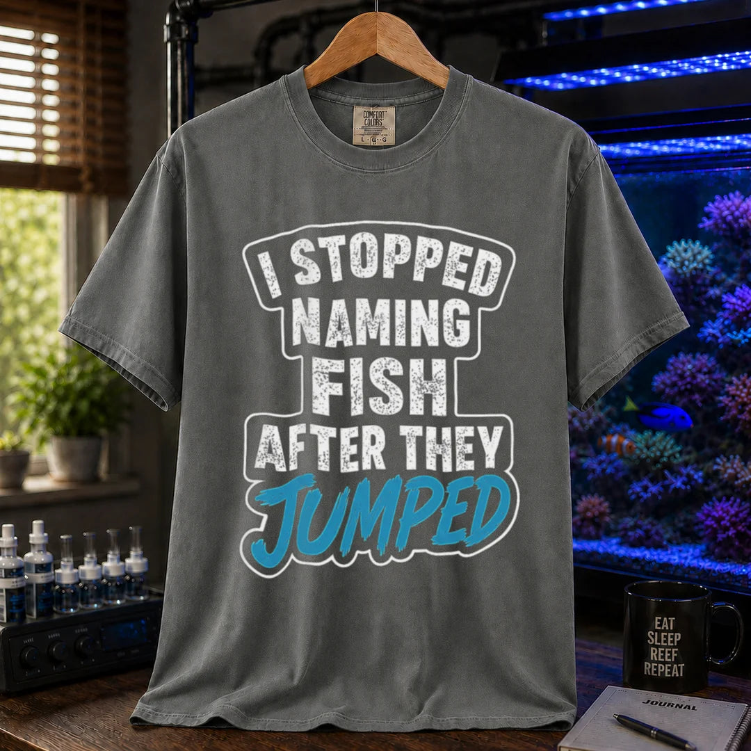 Saltwater aquarium graphic t-shirt featuring distressed block text and blue script: I STOPPED NAMING FISH AFTER THEY JUMPED, grey crew neck tee