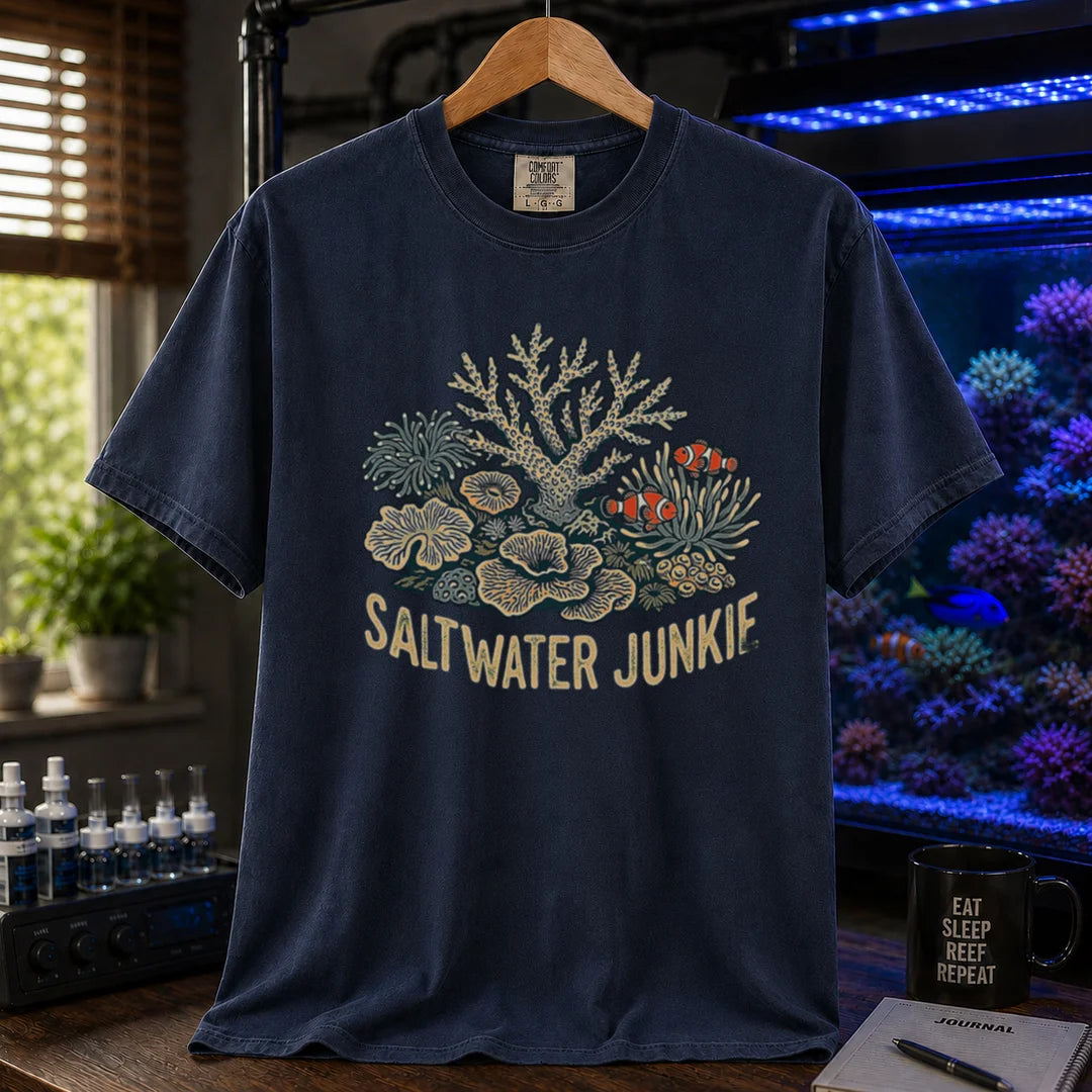 Saltwater aquarium graphic t-shirt featuring a coral reef and clownfish illustration with text: SALTWATER JUNKIE, navy crew neck tee