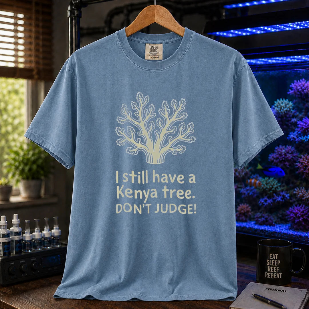 Saltwater aquarium graphic t-shirt featuring a Kenya tree coral illustration and text: I still have a Kenya tree. DON'T JUDGE!, blue crew neck tee