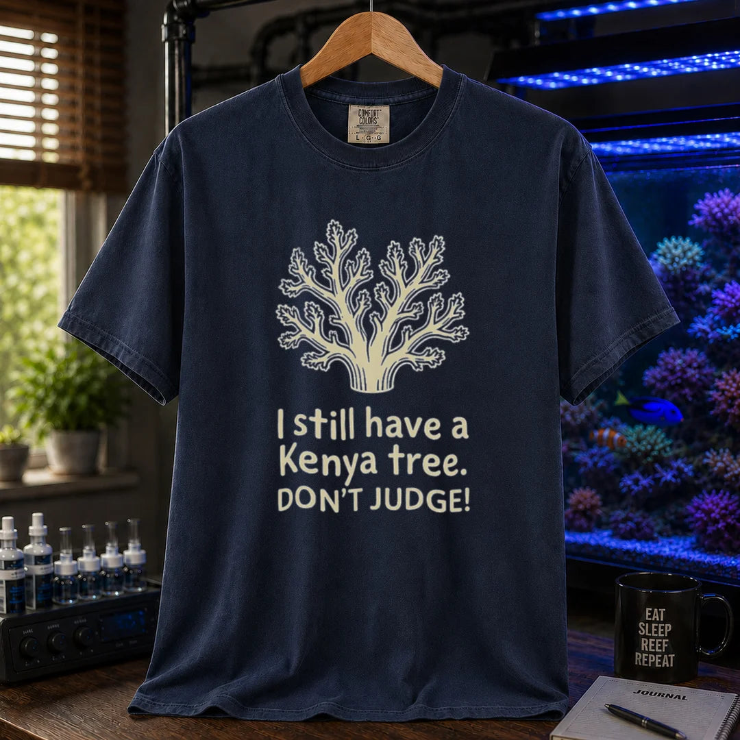 Saltwater aquarium graphic t-shirt featuring a Kenya tree coral illustration and text: I still have a Kenya tree. DON'T JUDGE!, navy crew neck tee