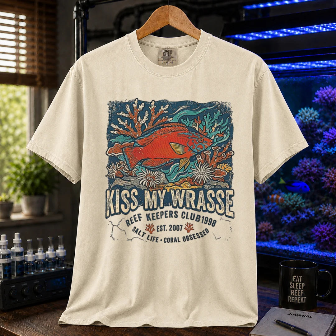 Saltwater aquarium graphic t-shirt featuring a wrasse and coral reef illustration with text: KISS MY WRASSE REEF KEEPERS CLUB, cream, beige, ivory crew neck tee