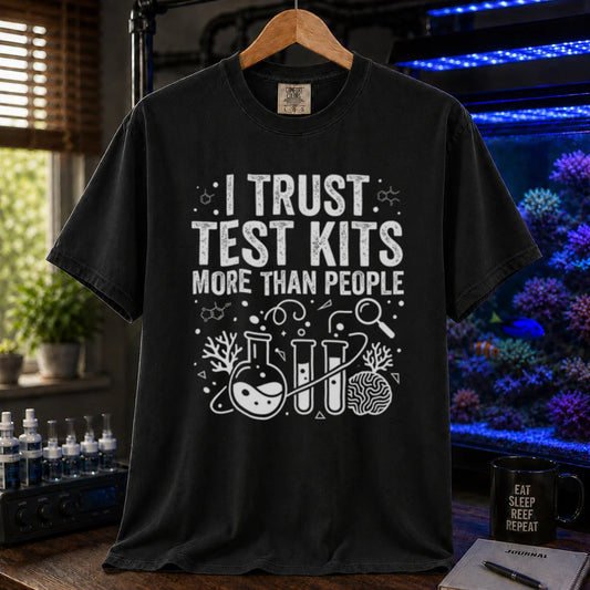 Saltwater aquarium graphic t-shirt featuring chemistry glassware and test tubes with text: I TRUST TEST KITS MORE THAN PEOPLE, black crew neck tee