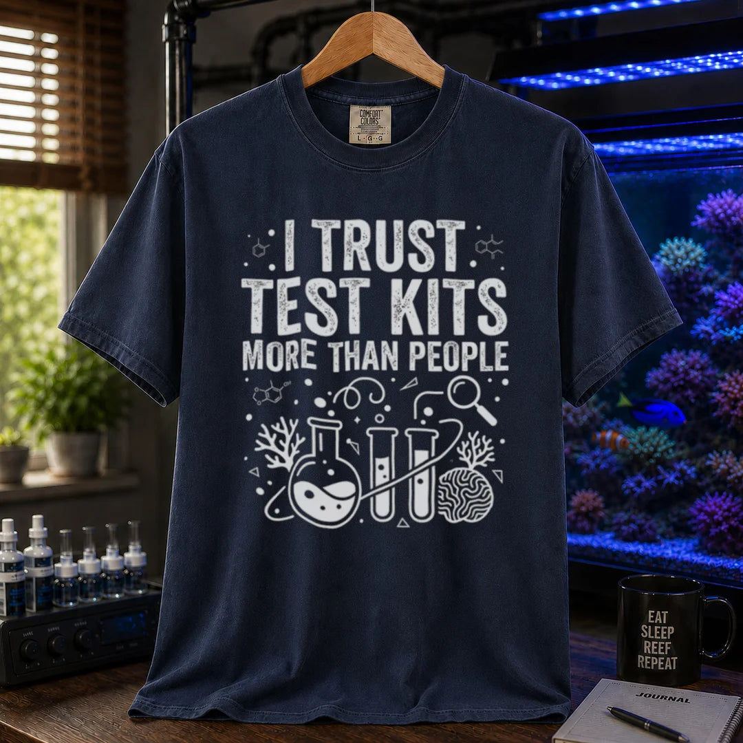 Saltwater aquarium graphic t-shirt featuring chemistry glassware and test tubes with text: I TRUST TEST KITS MORE THAN PEOPLE, navy crew neck tee