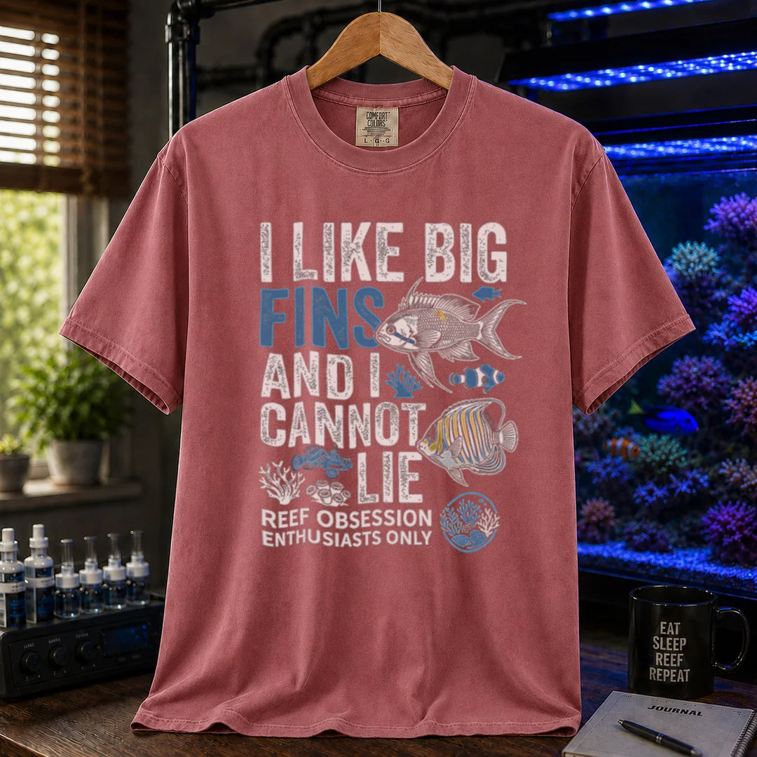 Saltwater aquarium graphic t-shirt featuring marine fish illustrations and text: I LIKE BIG FINS AND I CANNOT LIE REEF OBSESSION ENTHUSIASTS ONLY, light red crew neck tee
