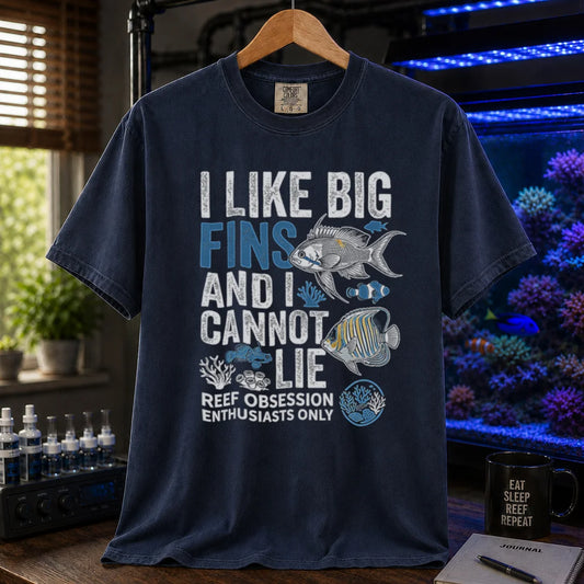 Saltwater aquarium graphic t-shirt featuring marine fish illustrations and text: I LIKE BIG FINS AND I CANNOT LIE REEF OBSESSION ENTHUSIASTS ONLY, navy crew neck tee