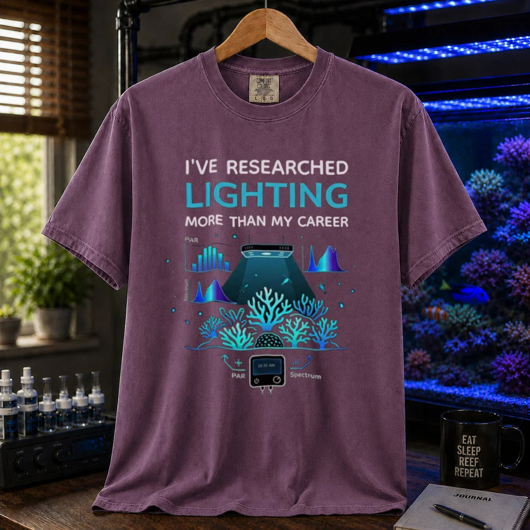 Saltwater aquarium graphic t-shirt featuring lighting and PAR graphs with text: I'VE RESEARCHED LIGHTING MORE THAN MY CAREER, purple crew neck tee