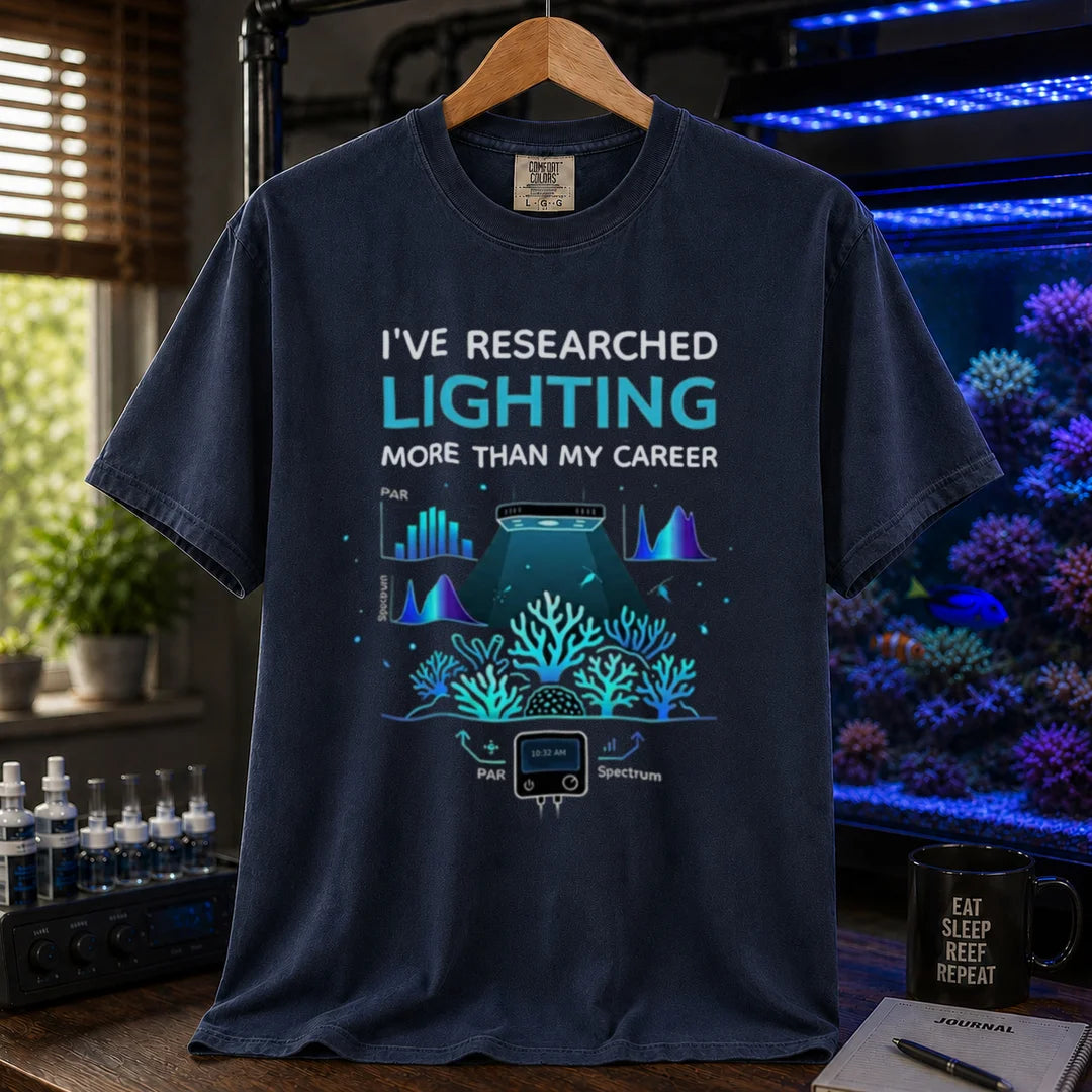 Saltwater aquarium graphic t-shirt featuring lighting and PAR graphs with text: I'VE RESEARCHED LIGHTING MORE THAN MY CAREER, navy crew neck tee
