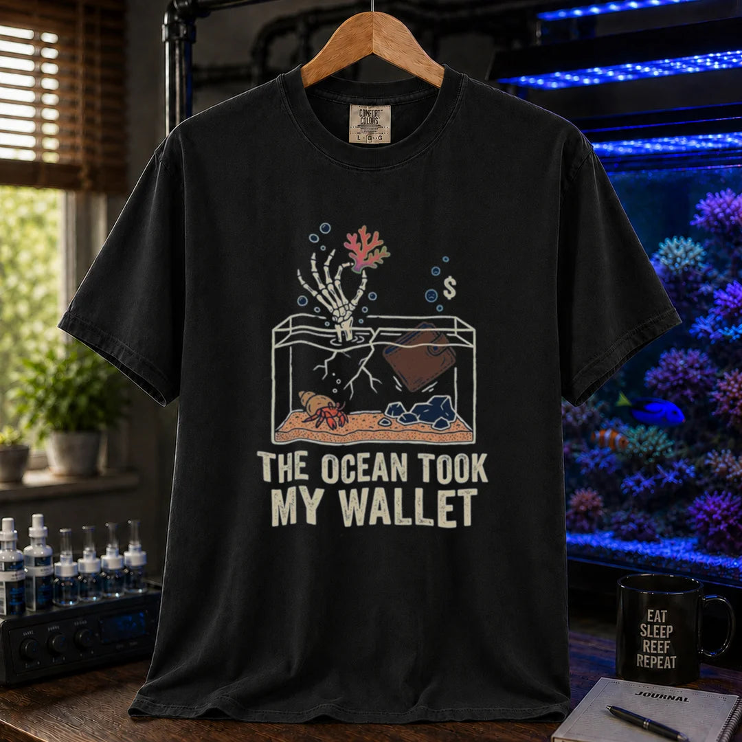 Saltwater aquarium graphic t-shirt featuring a skeleton hand and wallet in a tank illustration with text: THE OCEAN TOOK MY WALLET, black crew neck tee