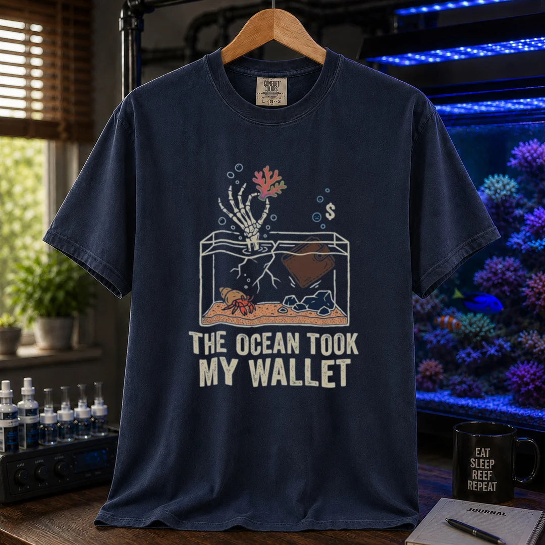 Saltwater aquarium graphic t-shirt featuring a skeleton hand and wallet in a tank illustration with text: THE OCEAN TOOK MY WALLET, navy crew neck tee