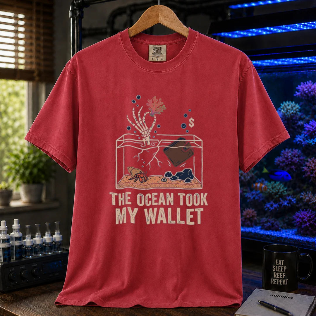 Saltwater aquarium graphic t-shirt featuring a skeleton hand and wallet in a tank illustration with text: THE OCEAN TOOK MY WALLET, red crew neck tee