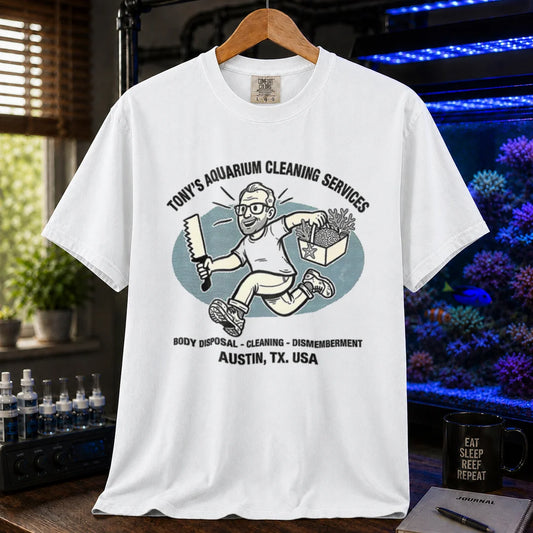 Saltwater aquarium graphic t-shirt featuring a cartoon illustration and text: TONY'S AQUARIUM CLEANING SERVICES BODY DISPOSAL - CLEANING - DISMEMBERMENT AUSTIN, TX. USA, white crew neck tee