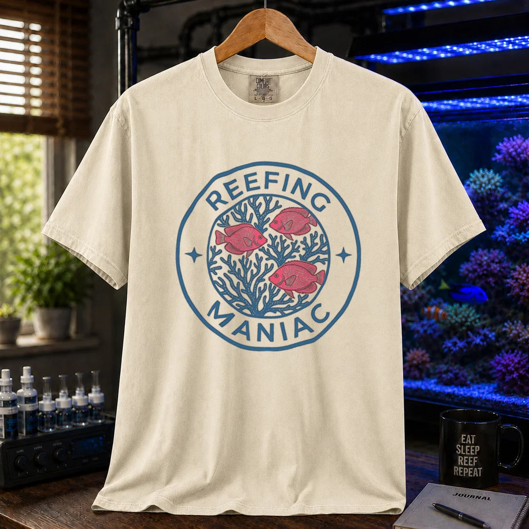 Saltwater aquarium graphic t-shirt featuring a circular coral and fish emblem with text: REEFING MANIAC, cream, beige, ivory crew neck tee