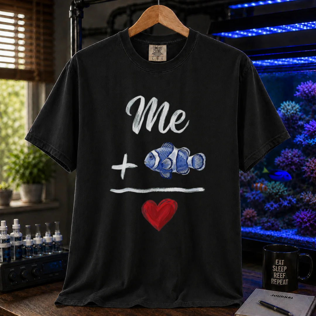 Saltwater aquarium graphic t-shirt featuring a hand-drawn math equation with text and art: Me + [Clownfish Illustration] = [Red Heart], black crew neck tee