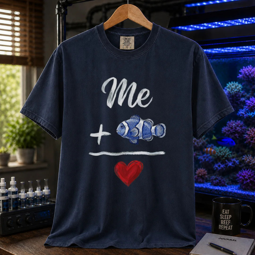 Saltwater aquarium graphic t-shirt featuring a hand-drawn math equation with text and art: Me + [Clownfish Illustration] = [Red Heart], navy crew neck tee
