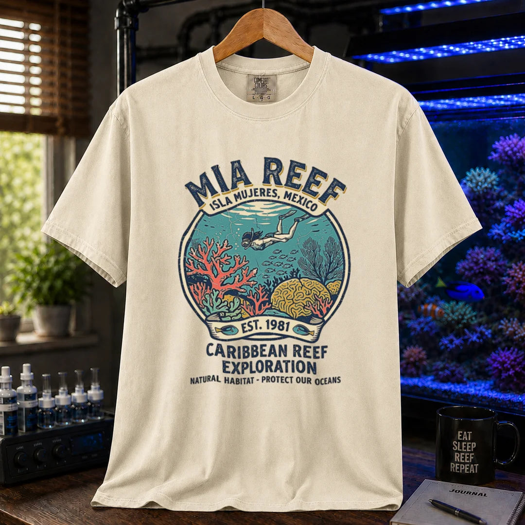 Saltwater aquarium graphic t-shirt featuring a circular diver and coral reef emblem with text: MIA REEF ISLA MUJERES, MEXICO CARIBBEAN REEF EXPLORATION NATURAL HABITAT - PROTECT OUR OCEANS, cream, beige, ivory crew neck tee