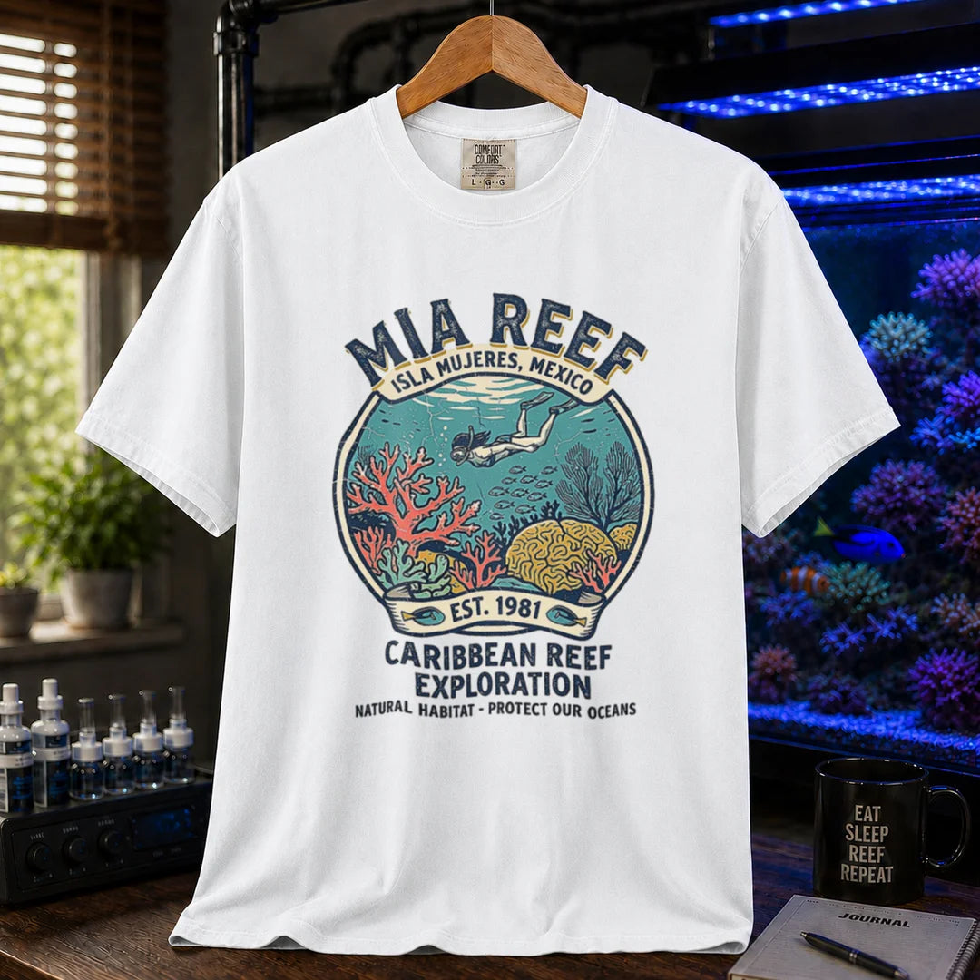 Saltwater aquarium graphic t-shirt featuring a circular diver and coral reef emblem with text: MIA REEF ISLA MUJERES, MEXICO CARIBBEAN REEF EXPLORATION NATURAL HABITAT - PROTECT OUR OCEANS, white crew neck tee