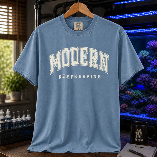 Saltwater aquarium graphic t-shirt featuring collegiate style arch text: MODERN REEFKEEPING, blue crew neck tee