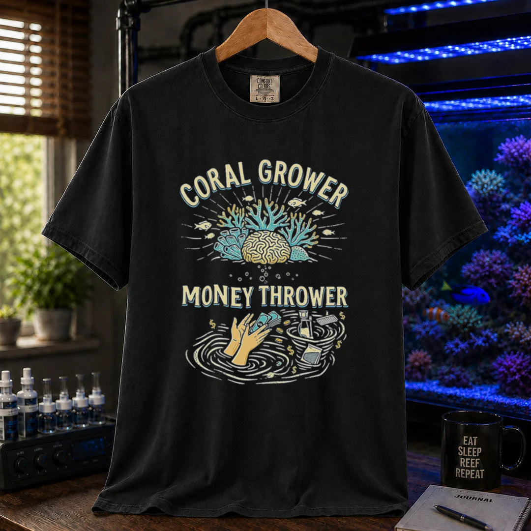 Saltwater aquarium graphic t-shirt featuring a two-part illustration of corals above and hands throwing cash into a gear whirlpool below with text: CORAL GROWER MONEY THROWER, black crew neck tee