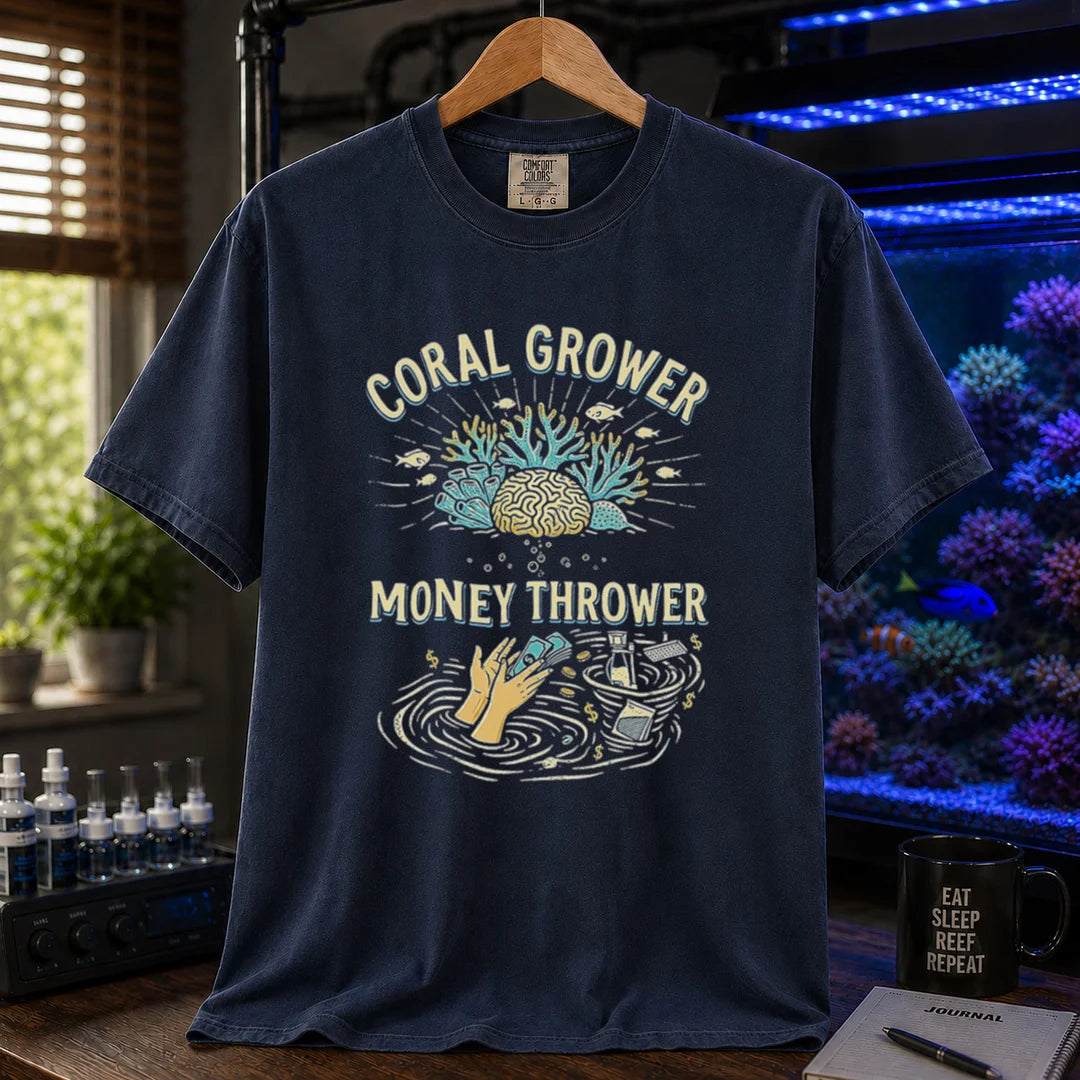 Saltwater aquarium graphic t-shirt featuring a two-part illustration of corals above and hands throwing cash into a gear whirlpool below with text: CORAL GROWER MONEY THROWER, navy crew neck tee