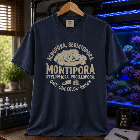 Saltwater aquarium graphic t-shirt featuring a circular coral badge design with text: ACROPORA, SERIATOPORA, MONTIPORA STYLOPHORA, POCILLOPORA. ONLY ONE COLOR: BROWN, navy crew neck tee