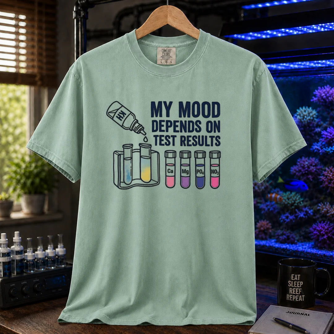 Saltwater aquarium graphic t-shirt featuring test kit and tube illustrations with text: MY MOOD DEPENDS ON TEST RESULTS, green crew neck tee
