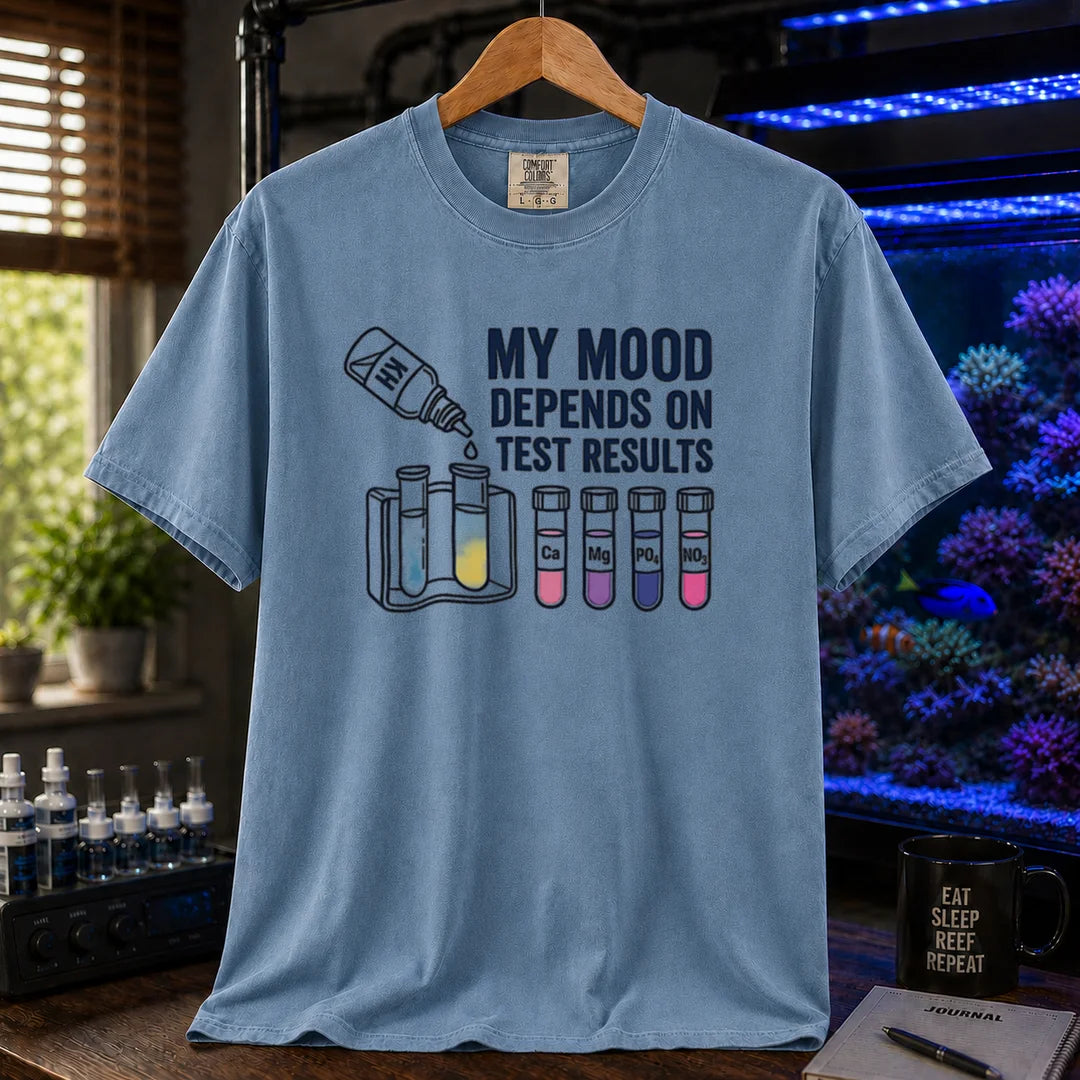 Saltwater aquarium graphic t-shirt featuring test kit and tube illustrations with text: MY MOOD DEPENDS ON TEST RESULTS, blue crew neck tee