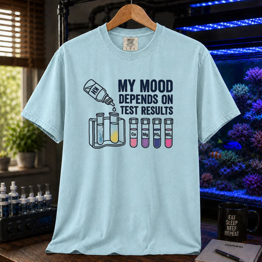 Saltwater aquarium graphic t-shirt featuring test kit and tube illustrations with text: MY MOOD DEPENDS ON TEST RESULTS, light blue crew neck tee