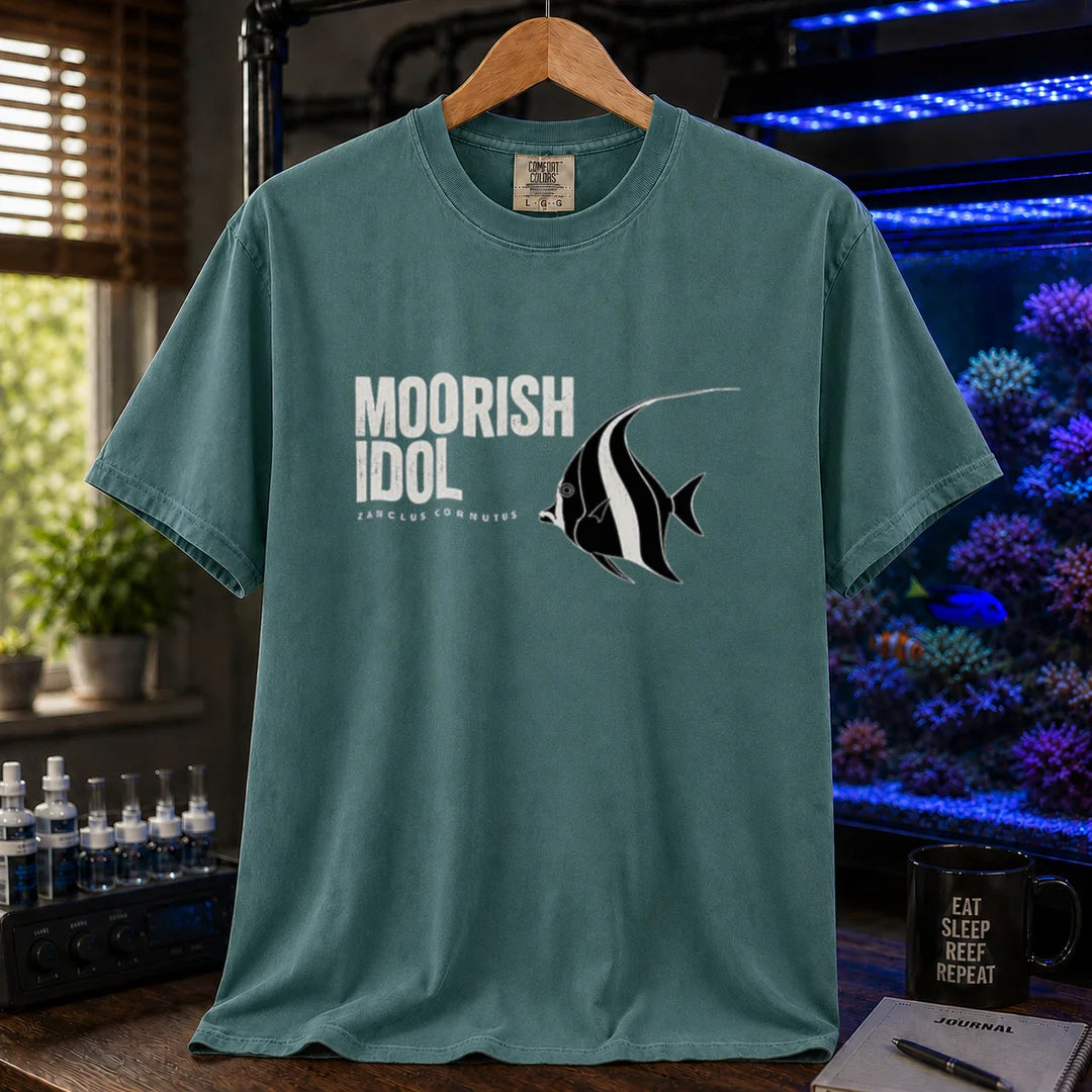 Saltwater aquarium graphic t-shirt featuring a Moorish Idol fish illustration and text: MOORISH IDOL ZANCLUS CORNUTUS, green crew neck tee