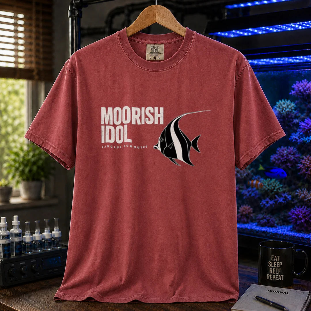 Saltwater aquarium graphic t-shirt featuring a Moorish Idol fish illustration and text: MOORISH IDOL ZANCLUS CORNUTUS, maroon, red crew neck tee