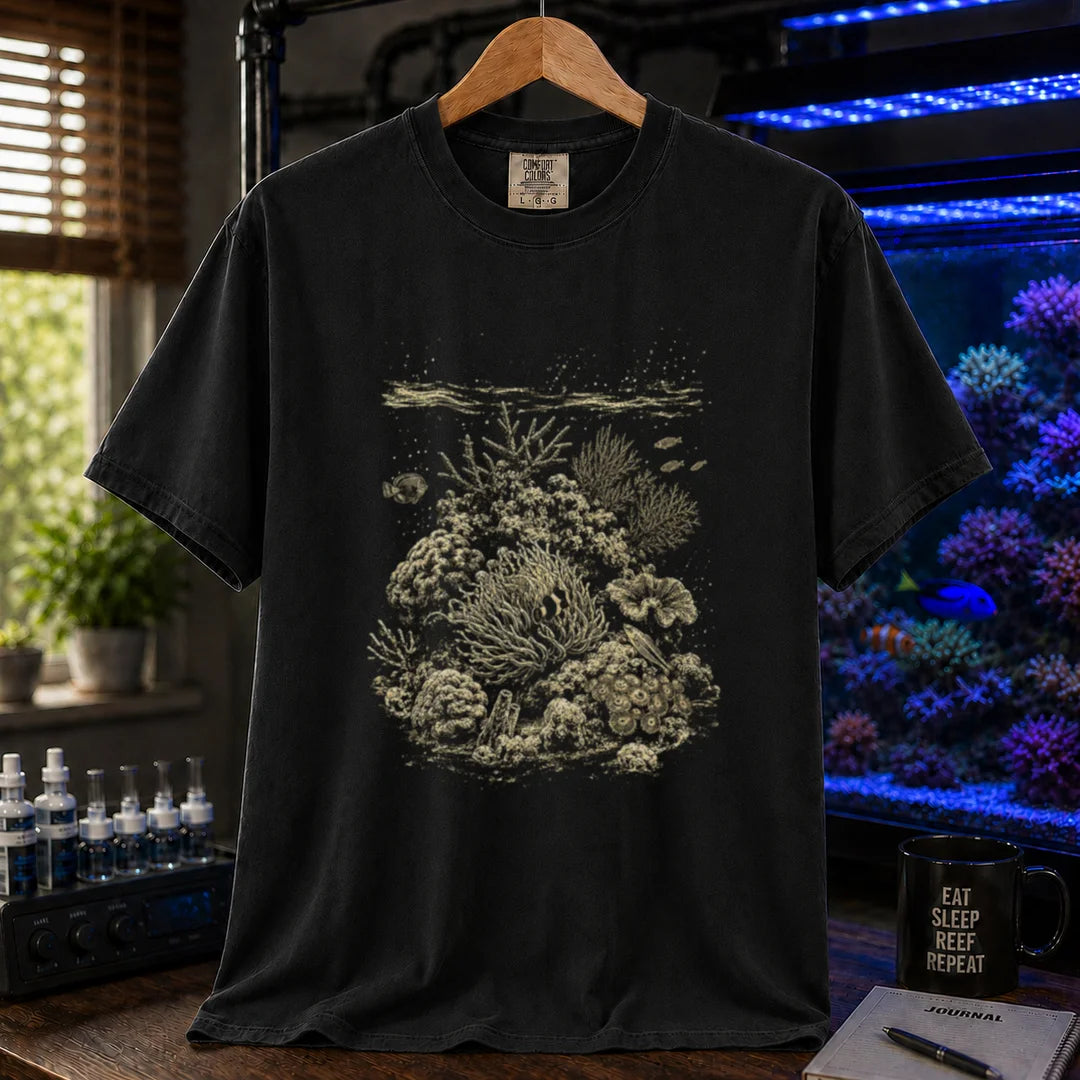 Saltwater aquarium graphic t-shirt featuring a detailed vintage scientific engraving of a coral reef ecosystem, black crew neck tee