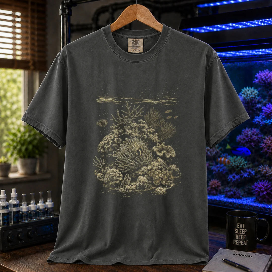 Saltwater aquarium graphic t-shirt featuring a detailed vintage scientific engraving of a coral reef ecosystem, dark grey crew neck tee