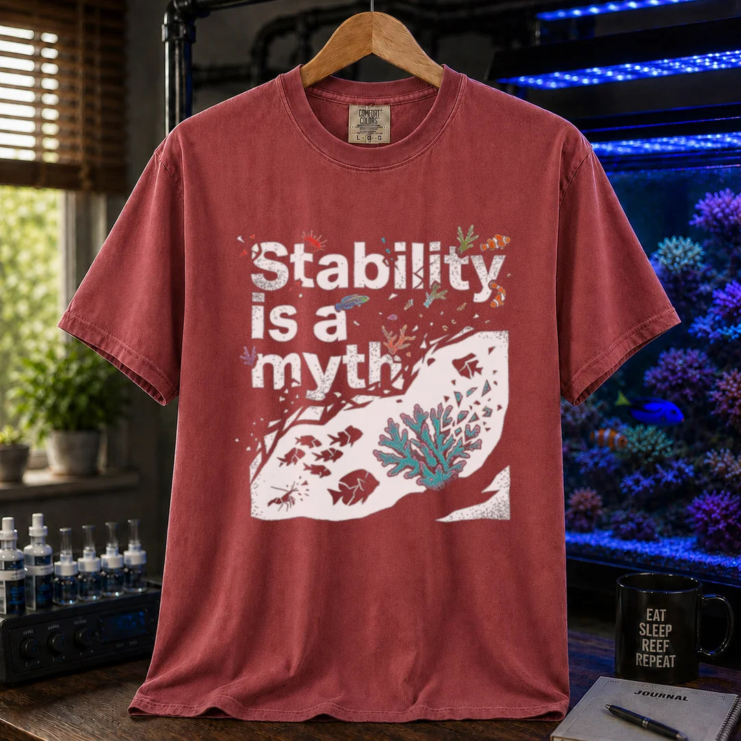 Saltwater aquarium graphic t-shirt featuring an abstract reef illustration and distressed text: Stability is a myth, maroon, red crew neck tee