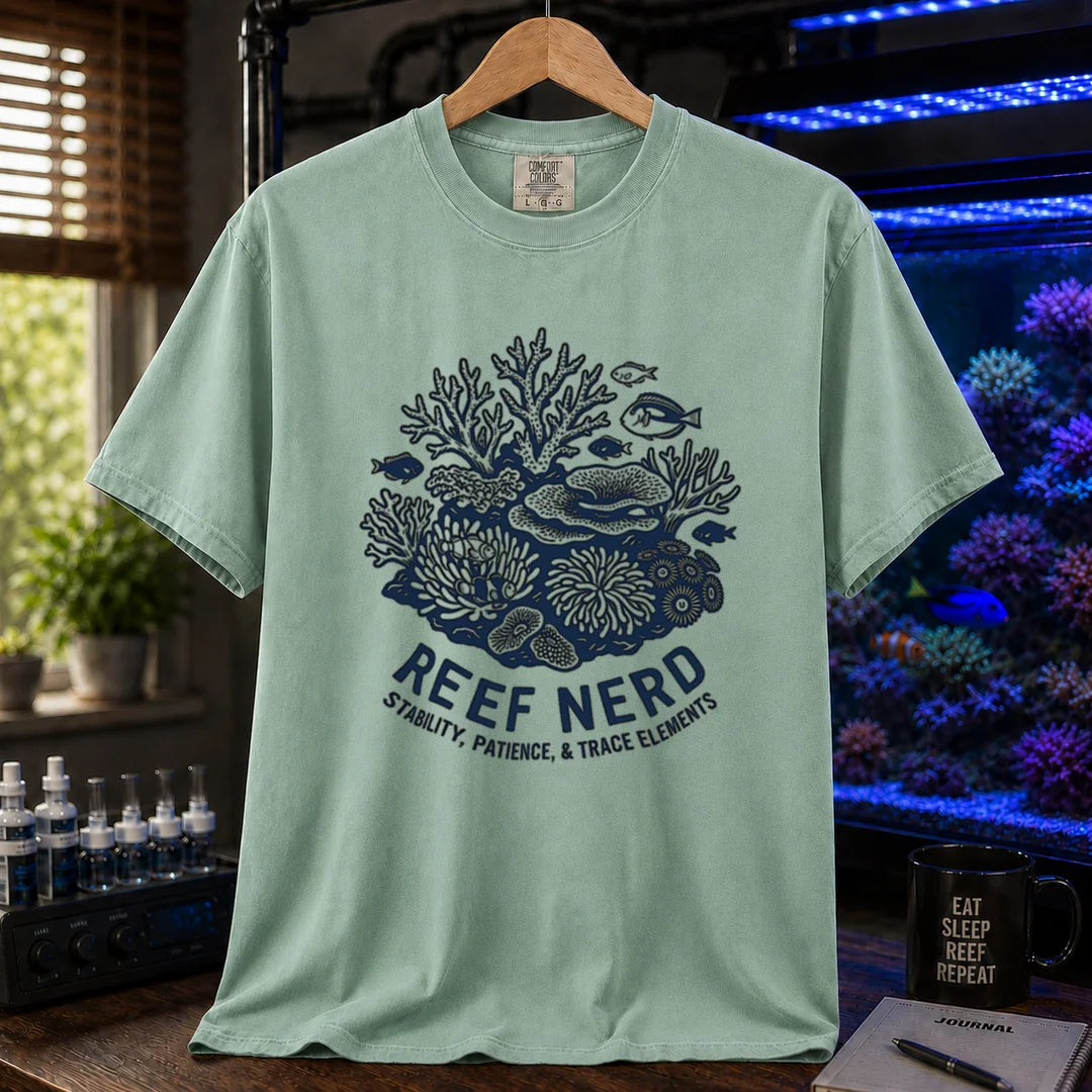 Saltwater aquarium graphic t-shirt featuring a detailed coral reef illustration with text: REEF NERD STABILITY, PATIENCE, & TRACE ELEMENTS, green crew neck tee