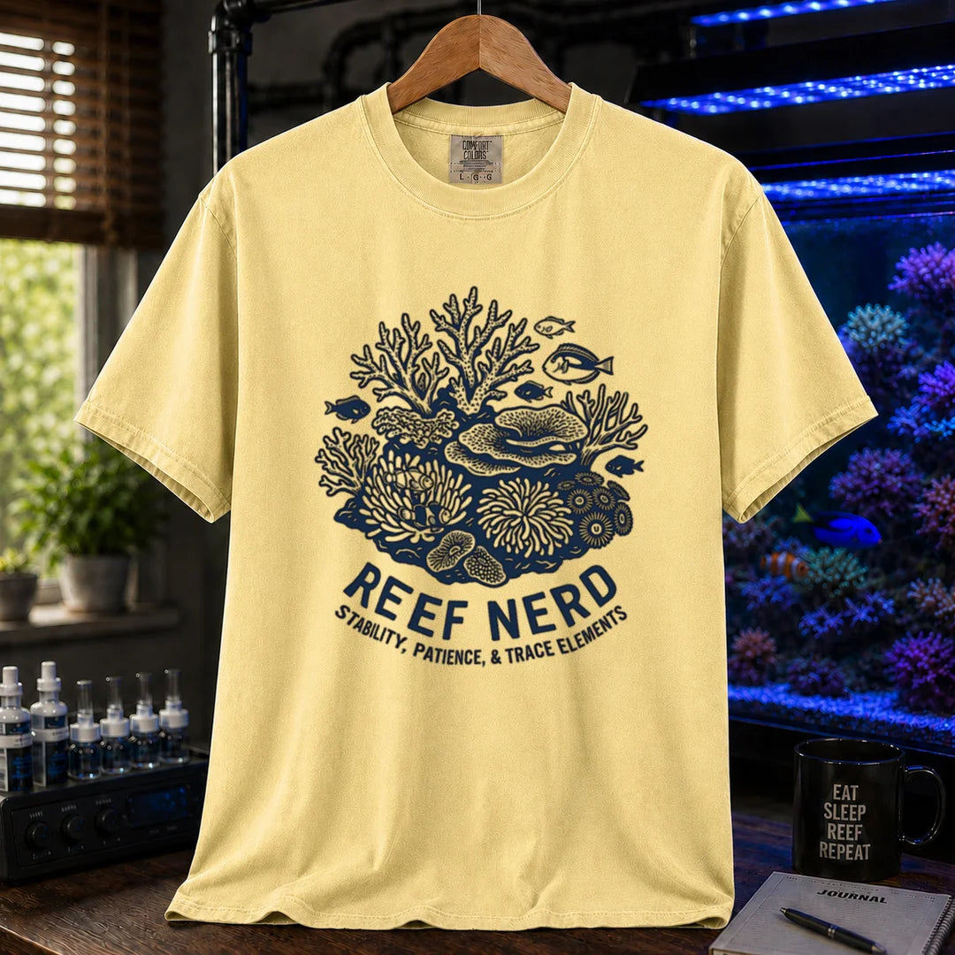 Saltwater aquarium graphic t-shirt featuring a detailed coral reef illustration with text: REEF NERD STABILITY, PATIENCE, & TRACE ELEMENTS, yellow crew neck tee