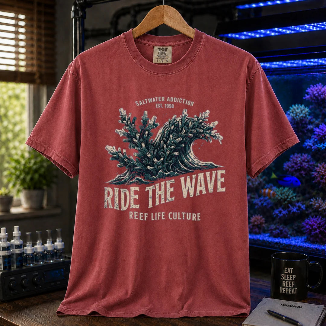 Saltwater aquarium graphic t-shirt featuring a vintage ocean wave made of coral and text: SALTWATER ADDICTION RIDE THE WAVE REEF LIFE CULTURE, maroon, red crew neck tee