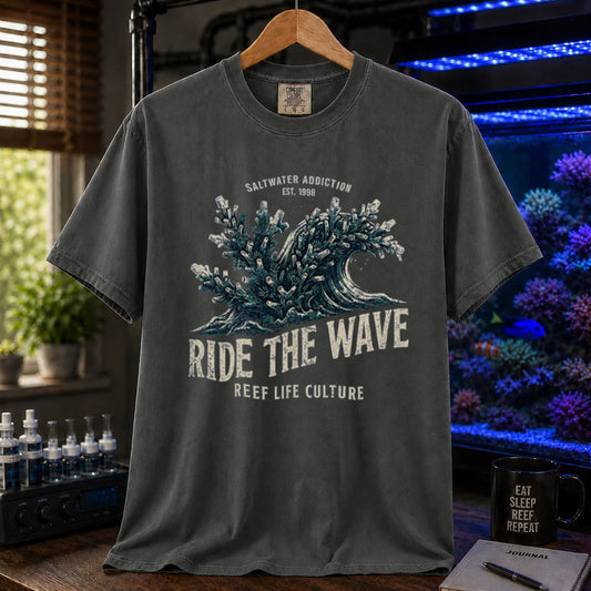 Saltwater aquarium graphic t-shirt featuring a vintage ocean wave made of coral and text: SALTWATER ADDICTION RIDE THE WAVE REEF LIFE CULTURE, dark grey crew neck tee